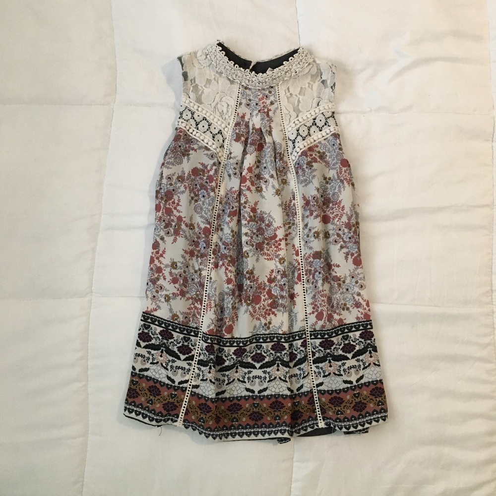 A sleeveless blouse with flower patterns